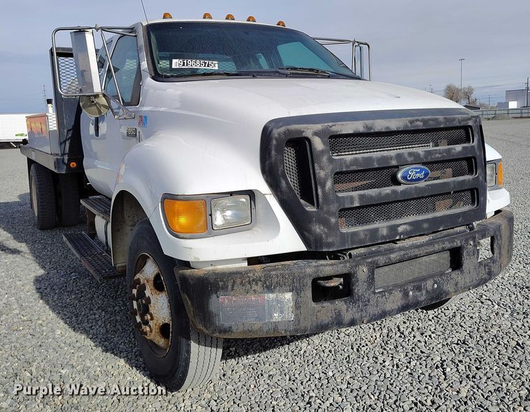 image for item YA1591 2004 Ford  F650 SuperCab flatbed truck