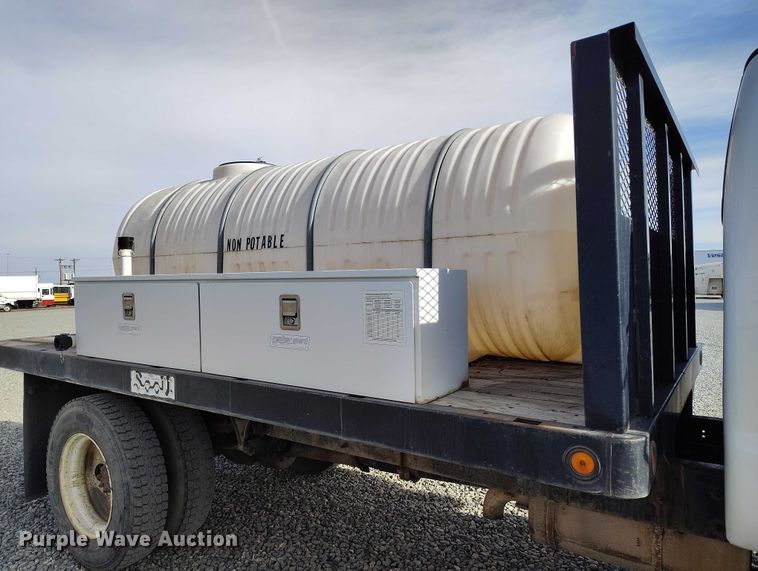 image for item YA1591 2004 Ford  F650 SuperCab flatbed truck