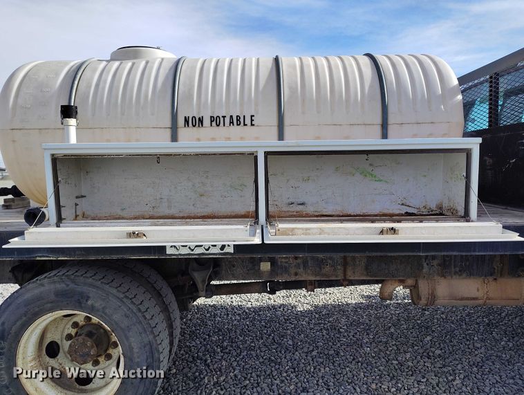 image for item YA1591 2004 Ford  F650 SuperCab flatbed truck