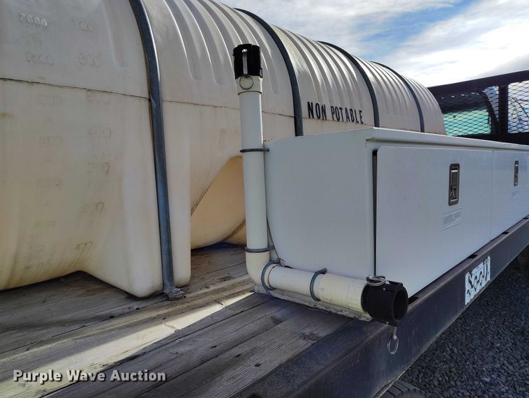 image for item YA1591 2004 Ford  F650 SuperCab flatbed truck