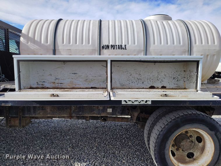 image for item YA1591 2004 Ford  F650 SuperCab flatbed truck