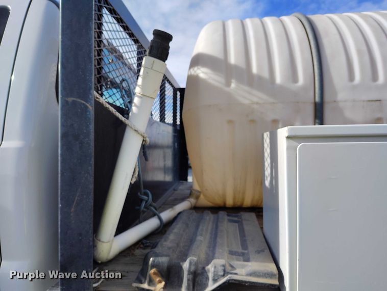 image for item YA1591 2004 Ford  F650 SuperCab flatbed truck