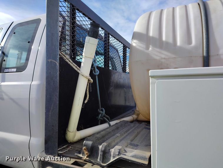 image for item YA1591 2004 Ford  F650 SuperCab flatbed truck