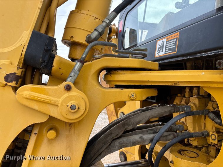 image for item ED2444 1999 John Deere 310E backhoe