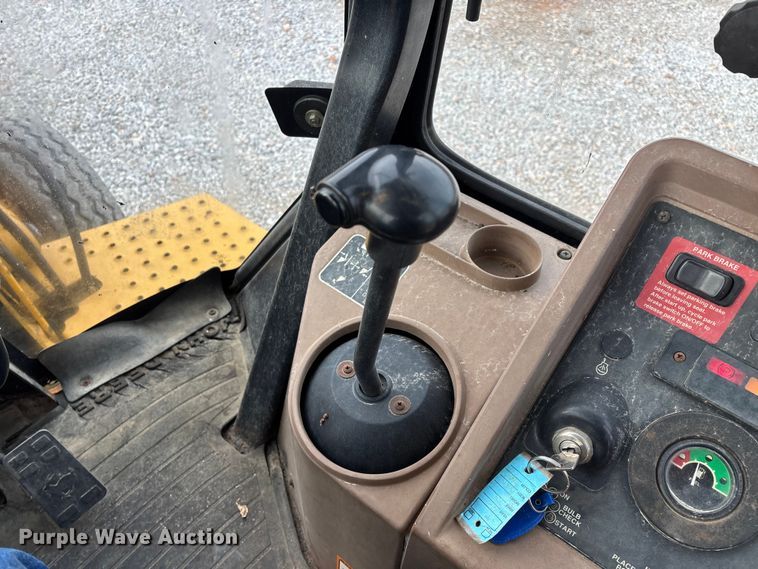 image for item ED2444 1999 John Deere 310E backhoe