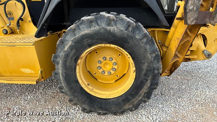 image for item ED2444 1999 John Deere 310E backhoe