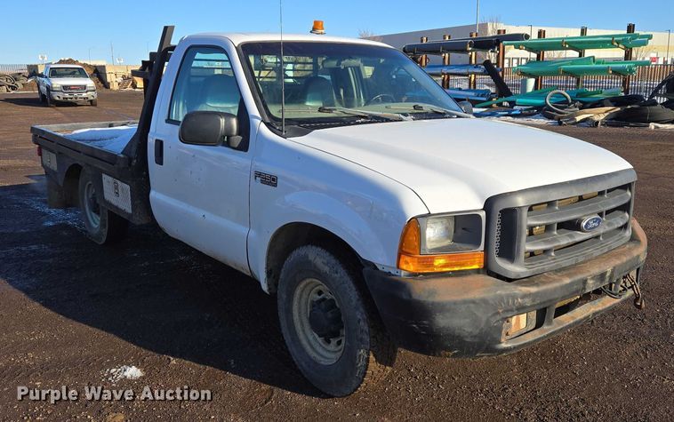 image for item ES2636 1999 Ford F250 flatbed pickup truck