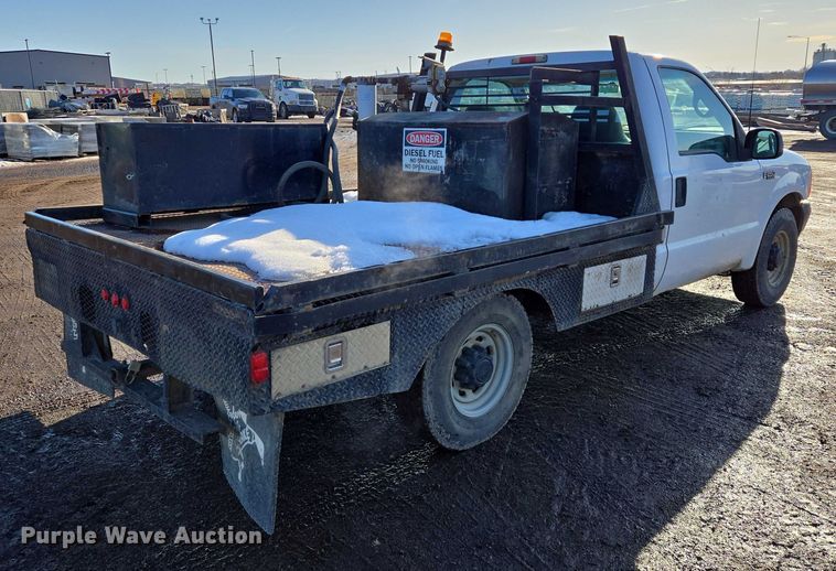 image for item ES2636 1999 Ford F250 flatbed pickup truck