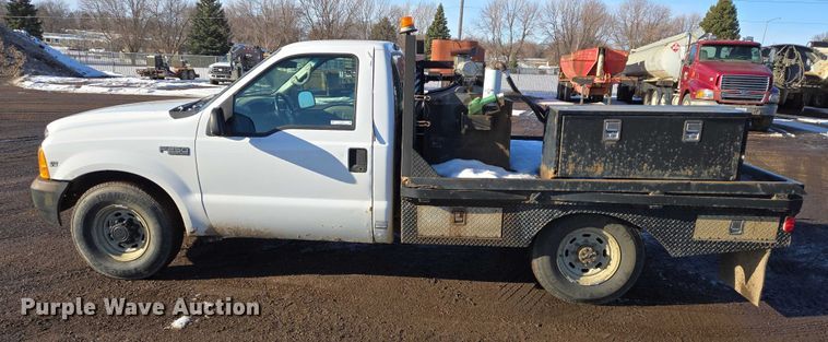 image for item ES2636 1999 Ford F250 flatbed pickup truck