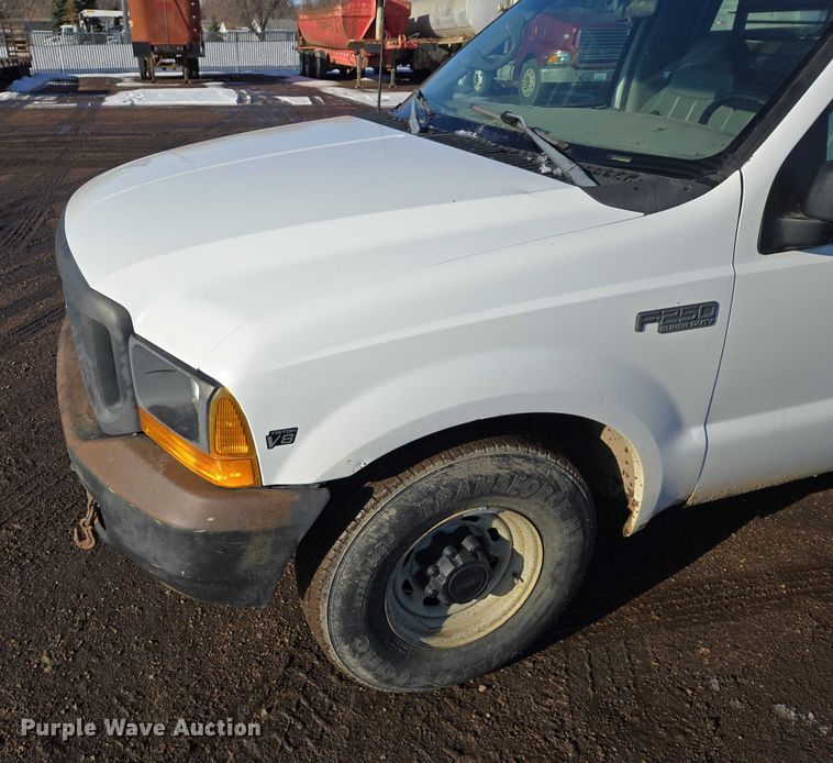 image for item ES2636 1999 Ford F250 flatbed pickup truck