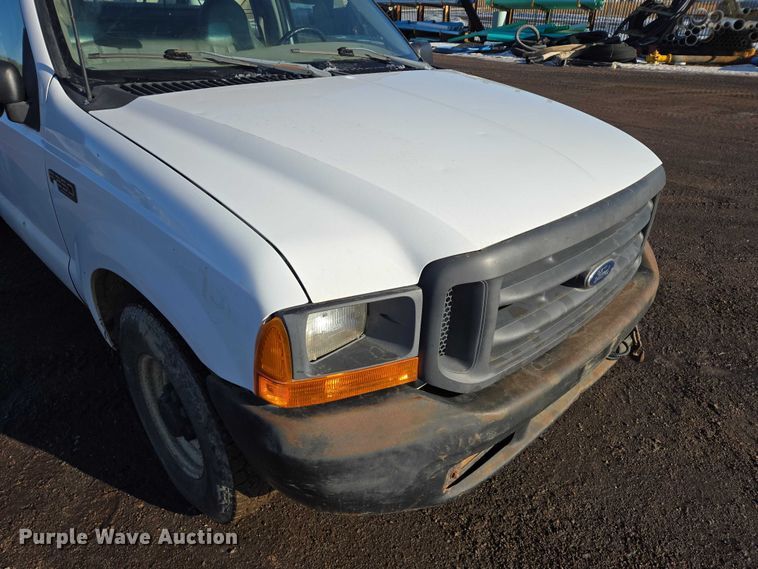 image for item ES2636 1999 Ford F250 flatbed pickup truck