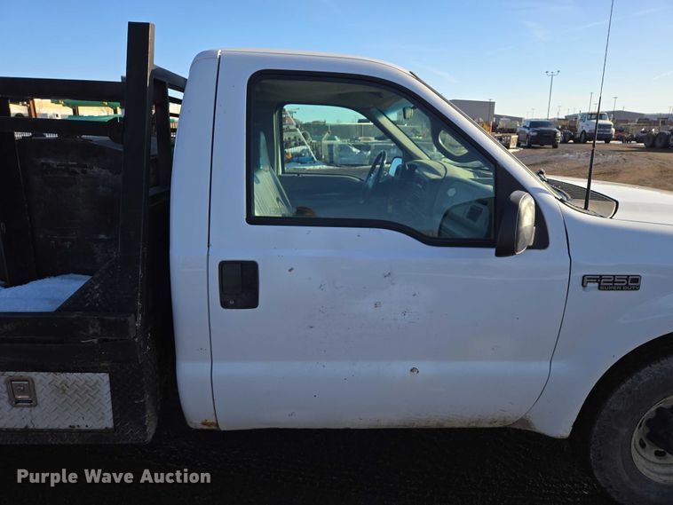 image for item ES2636 1999 Ford F250 flatbed pickup truck