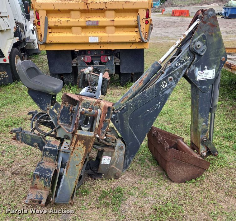 image for item DU2583 New Holland 609 skid steer backhoe