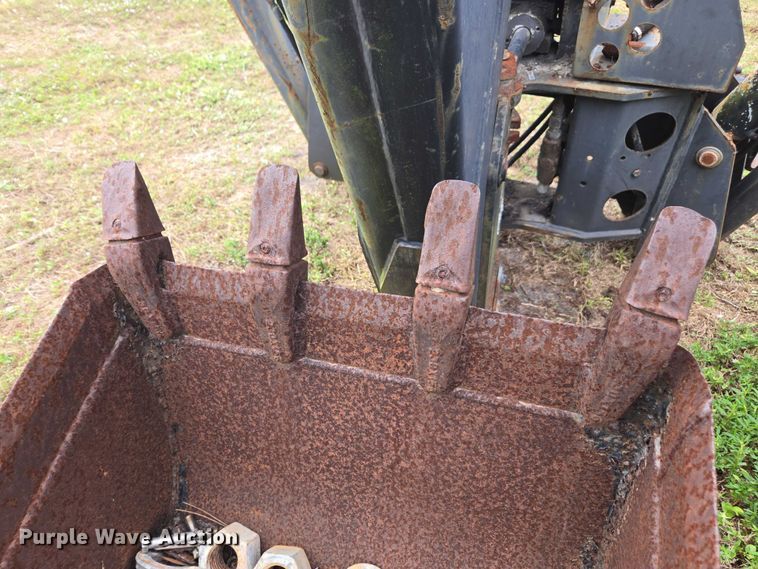 image for item DU2583 New Holland 609 skid steer backhoe