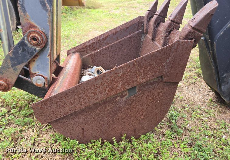 image for item DU2583 New Holland 609 skid steer backhoe