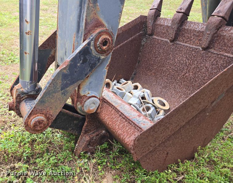 image for item DU2583 New Holland 609 skid steer backhoe