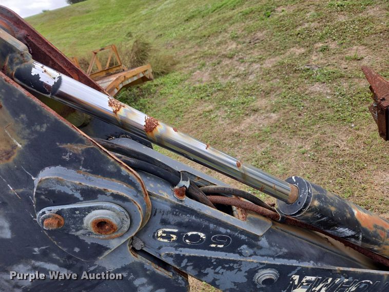 image for item DU2583 New Holland 609 skid steer backhoe