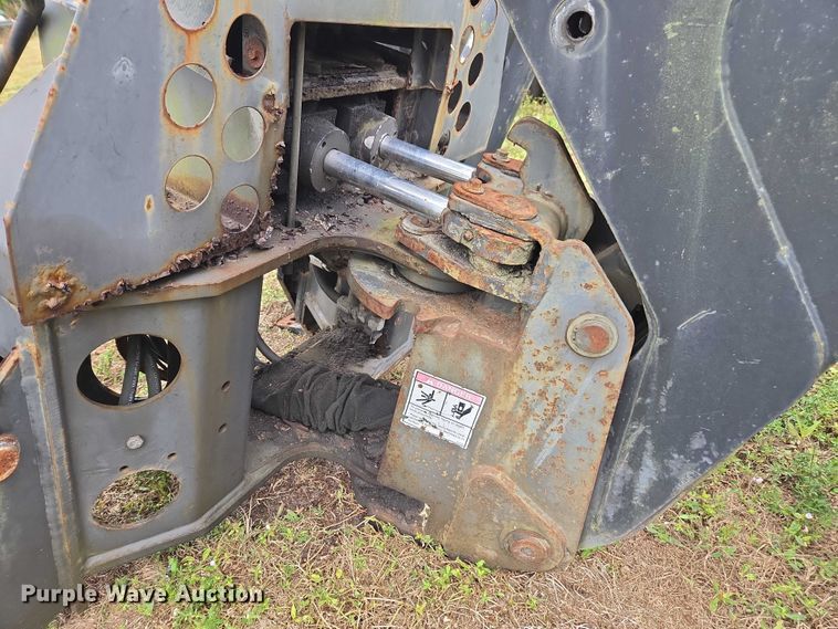 image for item DU2583 New Holland 609 skid steer backhoe