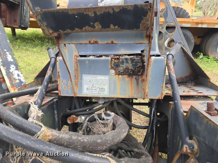 image for item DU2583 New Holland 609 skid steer backhoe