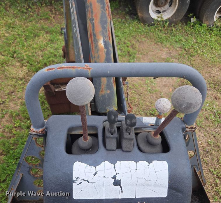 image for item DU2583 New Holland 609 skid steer backhoe