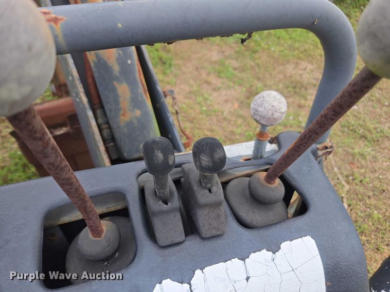 image for item DU2583 New Holland 609 skid steer backhoe