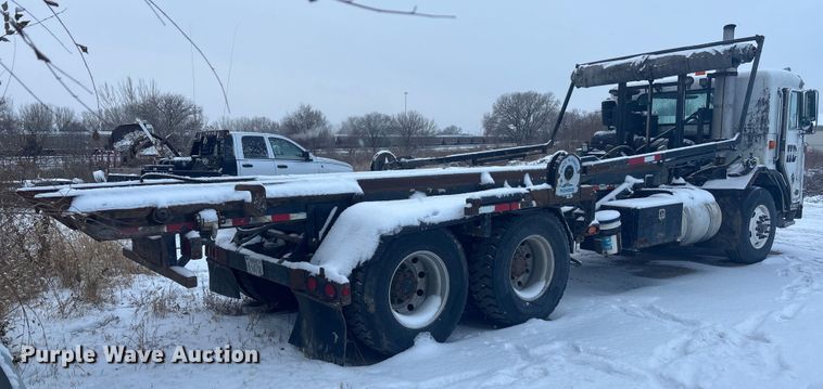 image for item DK0202 2002 Peterbilt 320 roll-off container truck