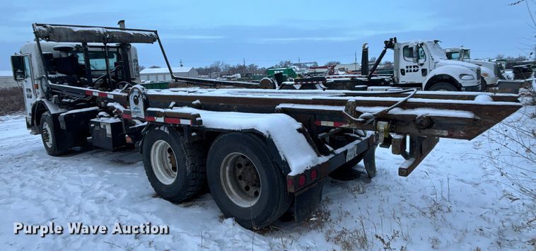 image for item DK0202 2002 Peterbilt 320 roll-off container truck