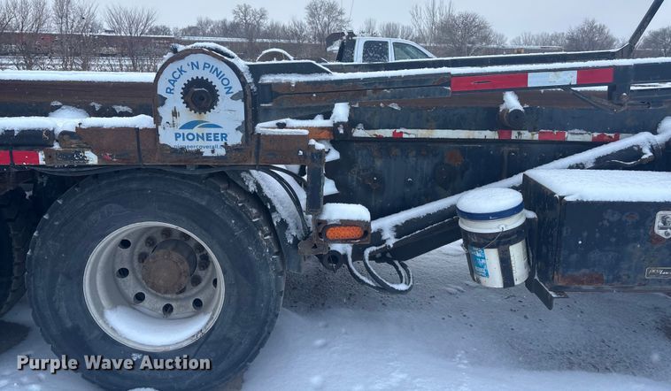 image for item DK0202 2002 Peterbilt 320 roll-off container truck