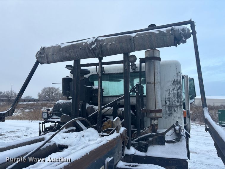 image for item DK0202 2002 Peterbilt 320 roll-off container truck