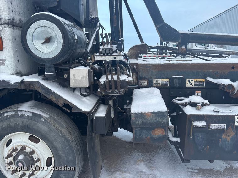 image for item DK0202 2002 Peterbilt 320 roll-off container truck