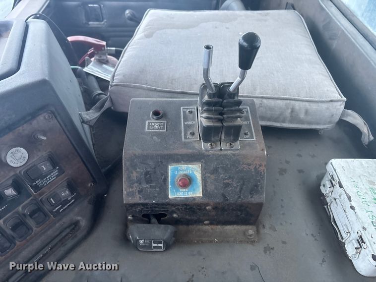 image for item DK0202 2002 Peterbilt 320 roll-off container truck