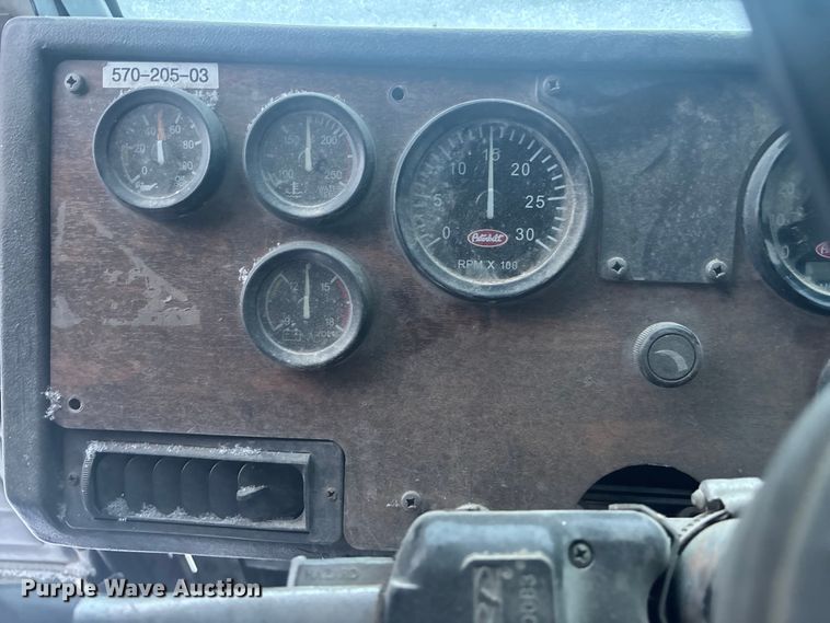 image for item DK0202 2002 Peterbilt 320 roll-off container truck