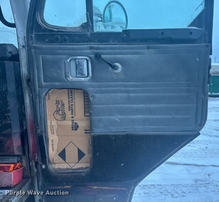 image for item DK0202 2002 Peterbilt 320 roll-off container truck