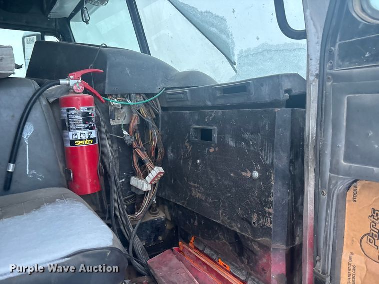 image for item DK0202 2002 Peterbilt 320 roll-off container truck