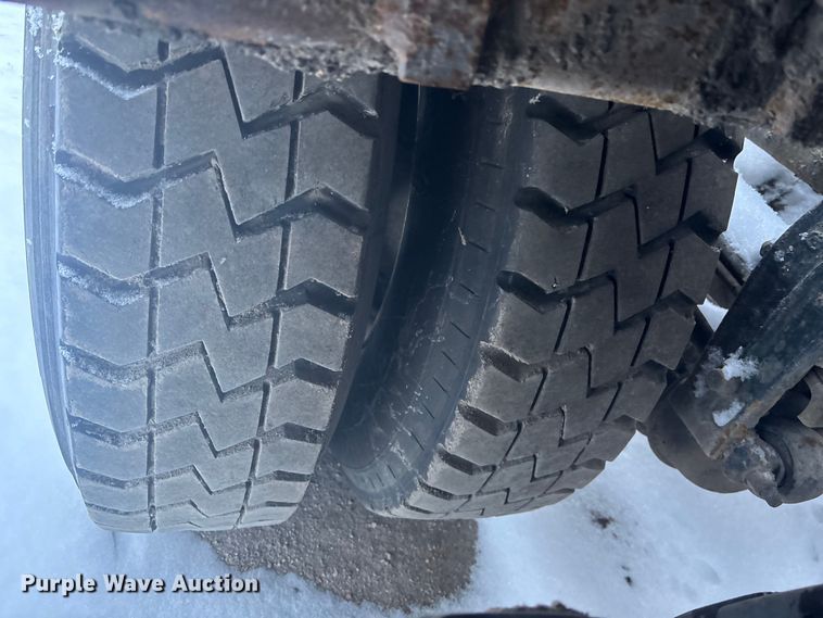 image for item DK0202 2002 Peterbilt 320 roll-off container truck