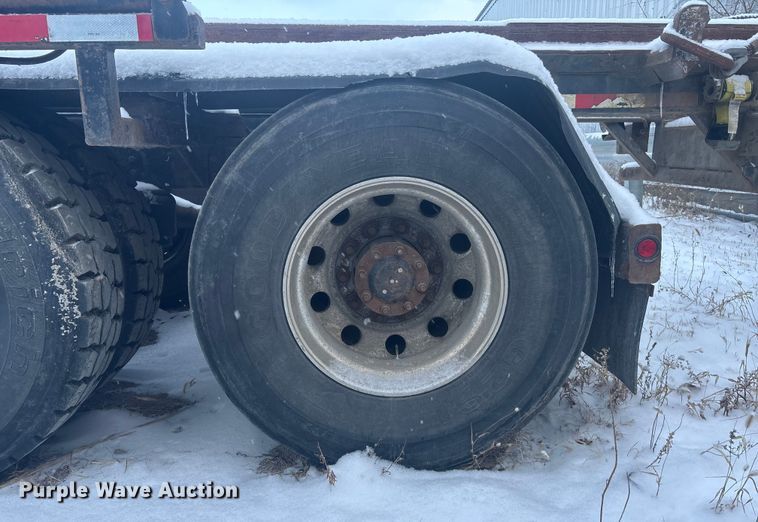 image for item DK0202 2002 Peterbilt 320 roll-off container truck