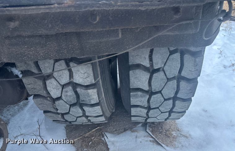 image for item DK0202 2002 Peterbilt 320 roll-off container truck