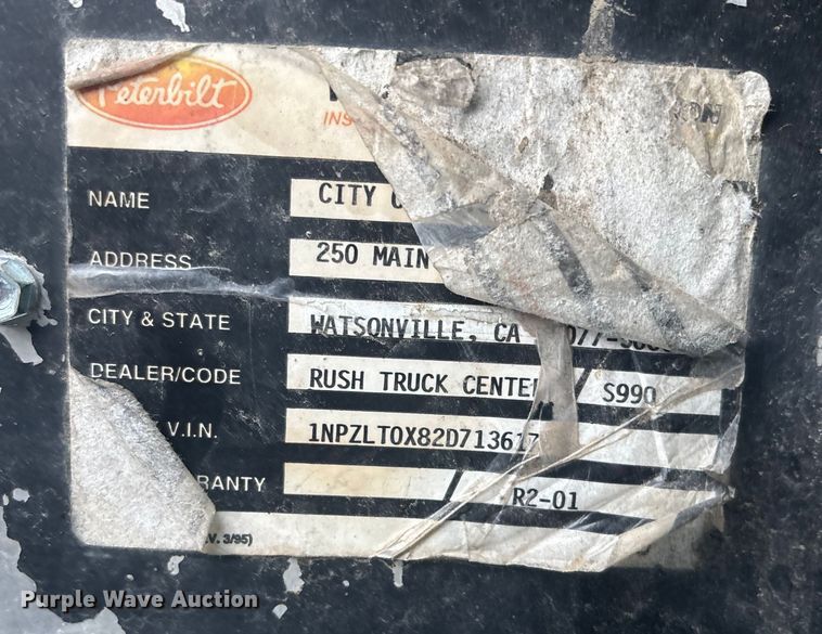 image for item DK0202 2002 Peterbilt 320 roll-off container truck