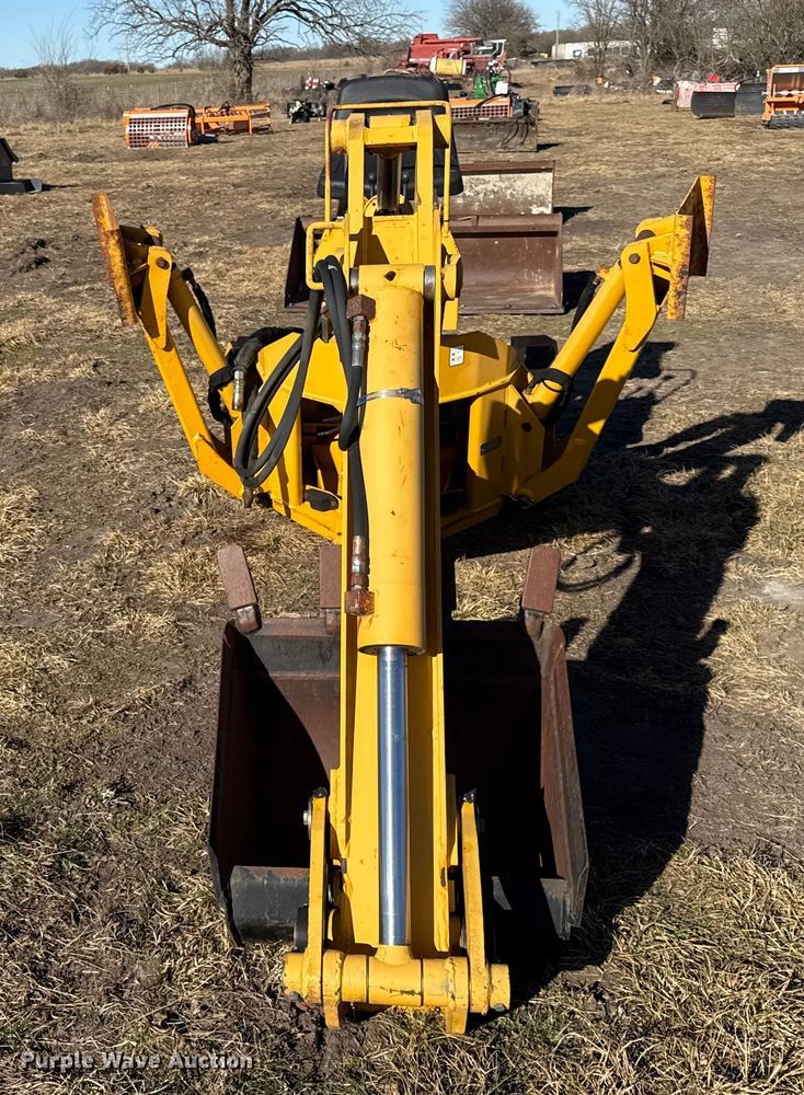 image for item EN0221 John Deere 911 extender skid steer backhoe