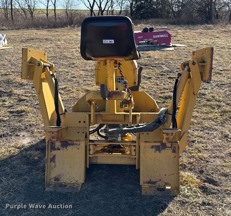 image for item EN0221 John Deere 911 extender skid steer backhoe