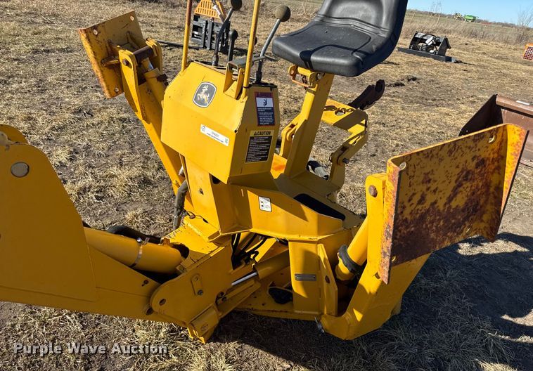 image for item EN0221 John Deere 911 extender skid steer backhoe