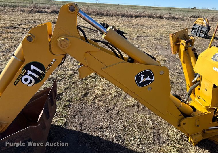 image for item EN0221 John Deere 911 extender skid steer backhoe