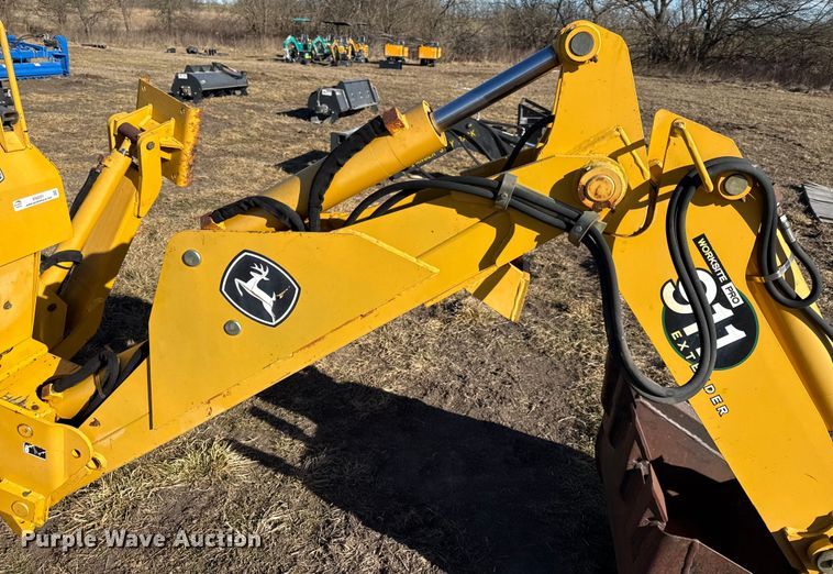 image for item EN0221 John Deere 911 extender skid steer backhoe