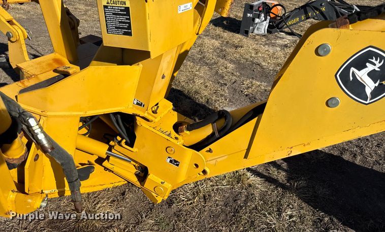 image for item EN0221 John Deere 911 extender skid steer backhoe