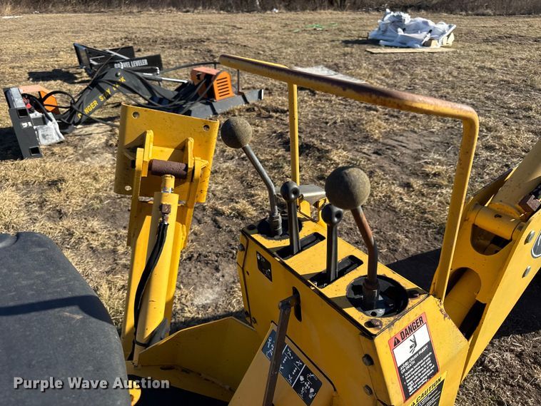 image for item EN0221 John Deere 911 extender skid steer backhoe