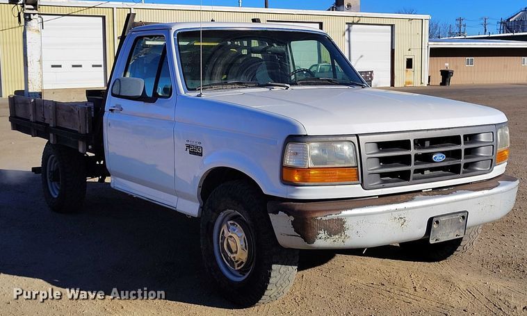 image for item DT0821 1997 Ford F250 flatbed pickup truck