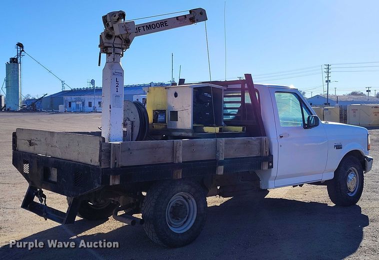 image for item DT0821 1997 Ford F250 flatbed pickup truck