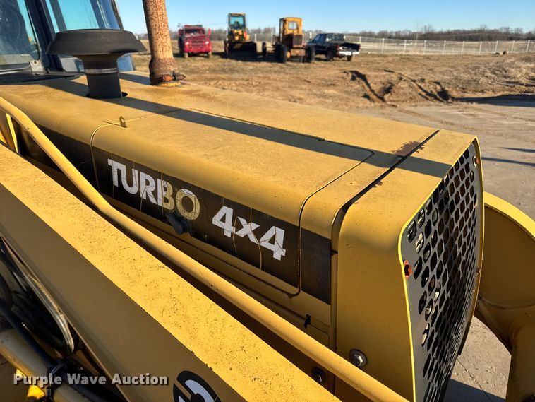 image for item EN0884 1999 John Deere 310SE backhoe