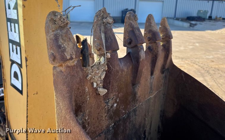 image for item EN0884 1999 John Deere 310SE backhoe