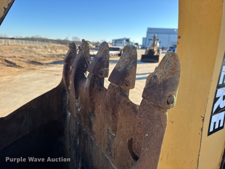 image for item EN0884 1999 John Deere 310SE backhoe